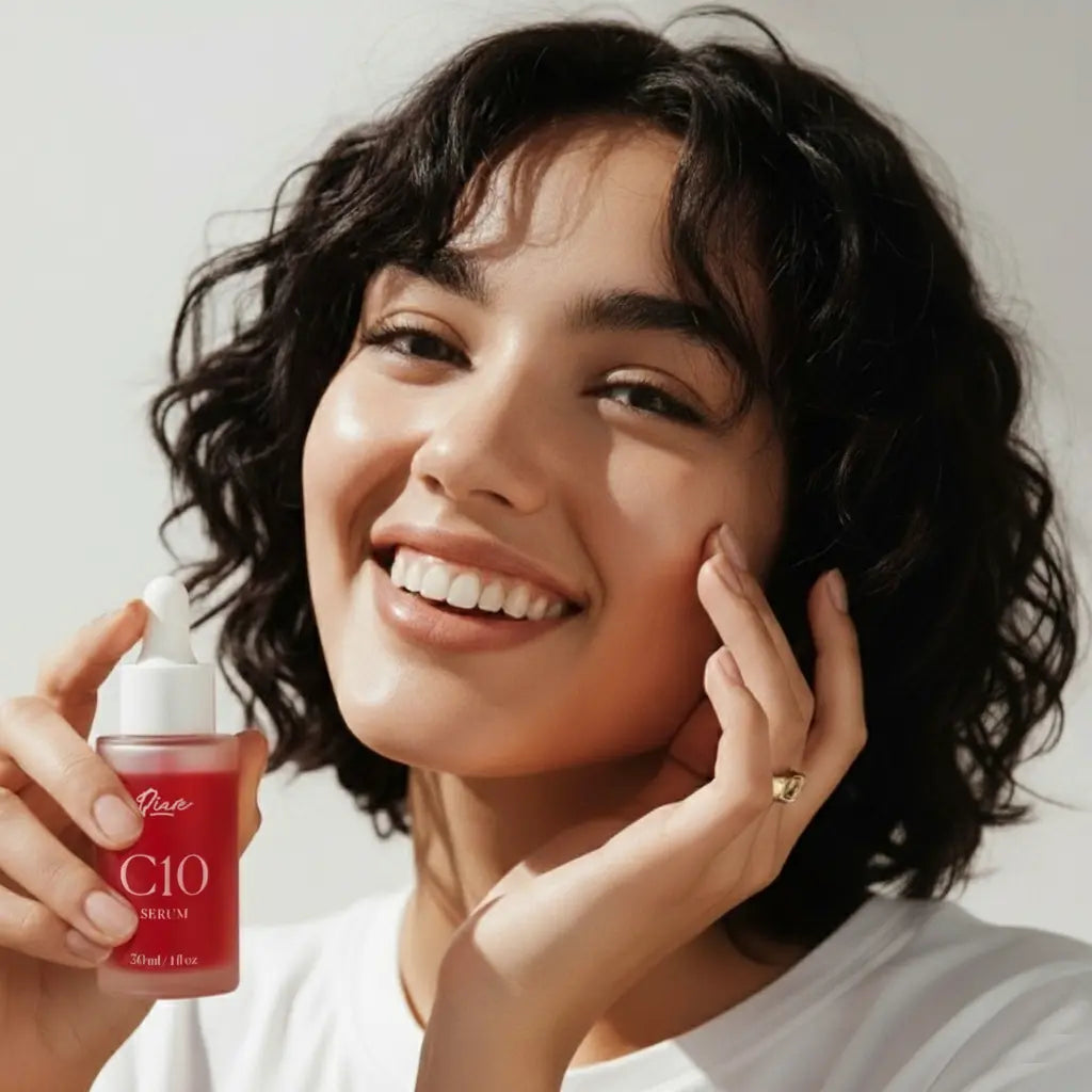 Discover our C10 serum with this image featuring a radiant woman smiling while holding the product. Perfect for showcasing glowing skin results, anti-aging benefits, and vitamin C skincare. This beauty shot highlights the effectiveness of C10 serum for a healthy complexion.